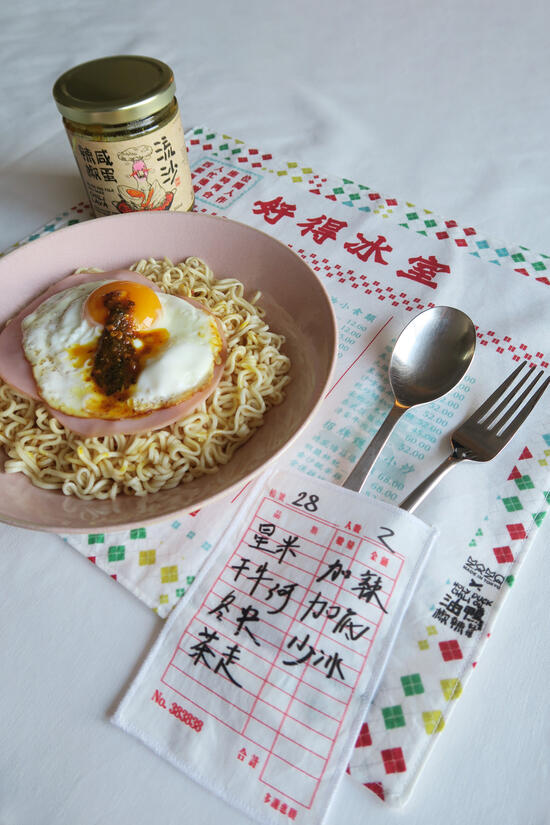 Tokyo-based Hong Kong Designer Momozaza JP collaborated with Canada's Holy Duck Chili launching a merchandise paying tribute to Hong Kong's 'Bing Sutt' diners.